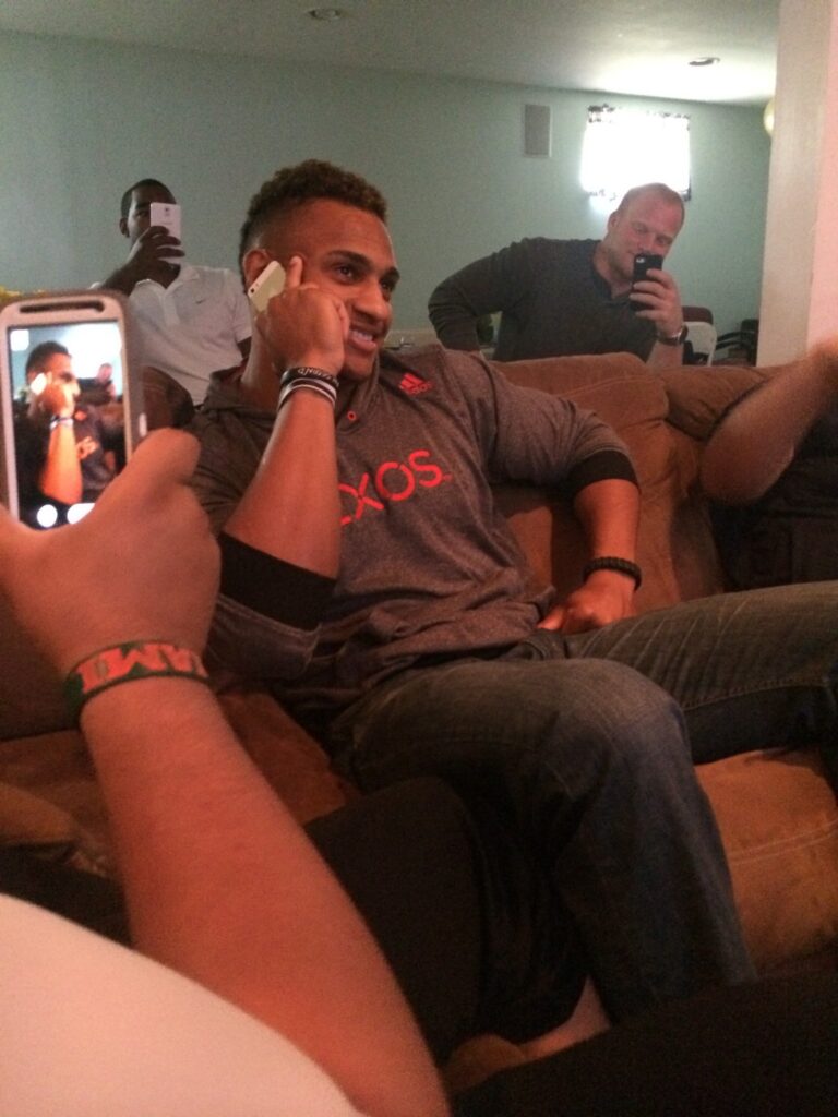 Khari Fortt on the phone Saturday with Saints GM Mickey Loomis, moments before New Orleans drafted him in the fourth round. (Photo: Dave Ruden)