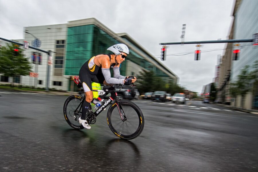 A racer heads down the streets of Stamford in the cycling portion of the triathlon. (Photo: Ron Hiner)
